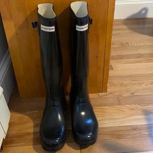 Gently used women’s tall Hunter Boots with socks.